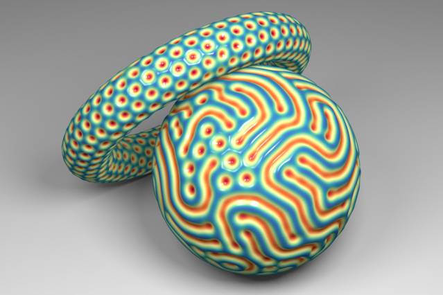 Pictured is a sphere with a combination of hexagons and labyrinthine patterns, and a more complex, torus-shaped object with hexagonal dimples.
