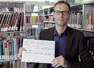 Dr. Jan Camenisch, cryptographer and data privacy scientist at IBM Research holds a piece of the IBM identity Mixer algorithm.