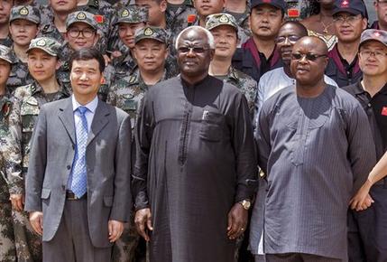 Chinese Ambassador Zhao Yanbo, center left, stands next to Sierra Leone's President Ernest Bai Koroma, center, and Sierra Leone's Vice President Samuel Sam-Sumana, centre right