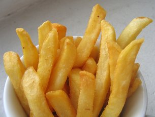French fries being deep fried medium