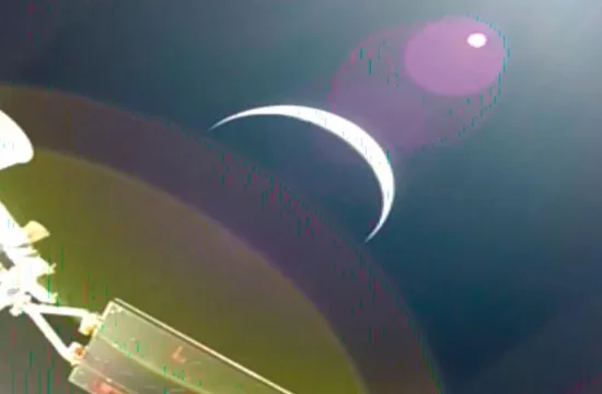 Earths crescent is seen from a solar array camera on the Orion spacecraft