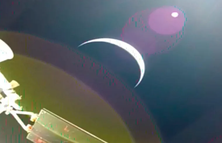 Earths crescent is seen from a solar array camera on the Orion spacecraft